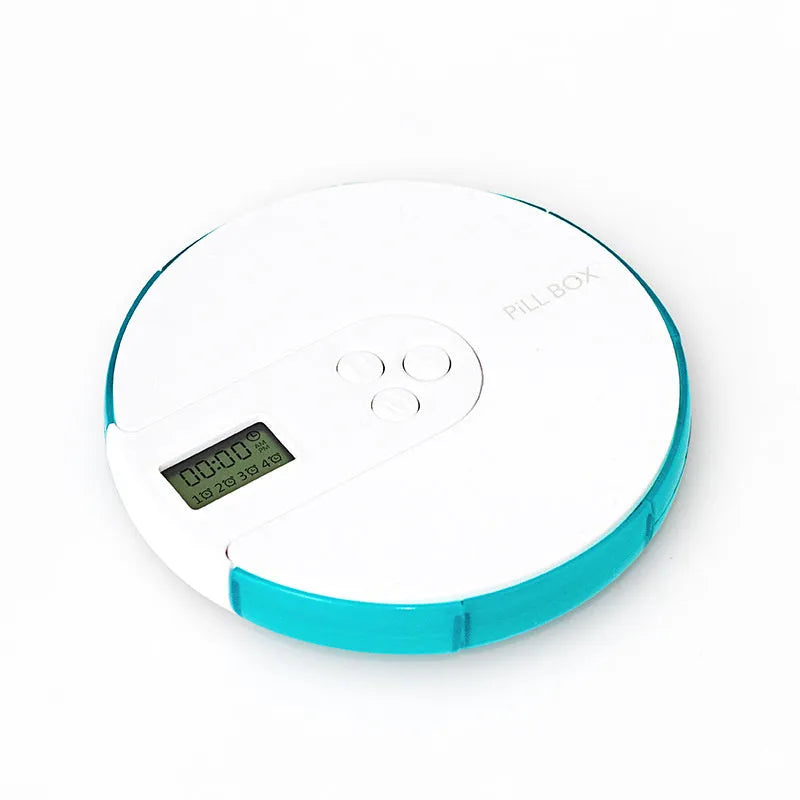 Blue 7-compartment alarm clock pill dispenser showing timer display and open lid with compartments.