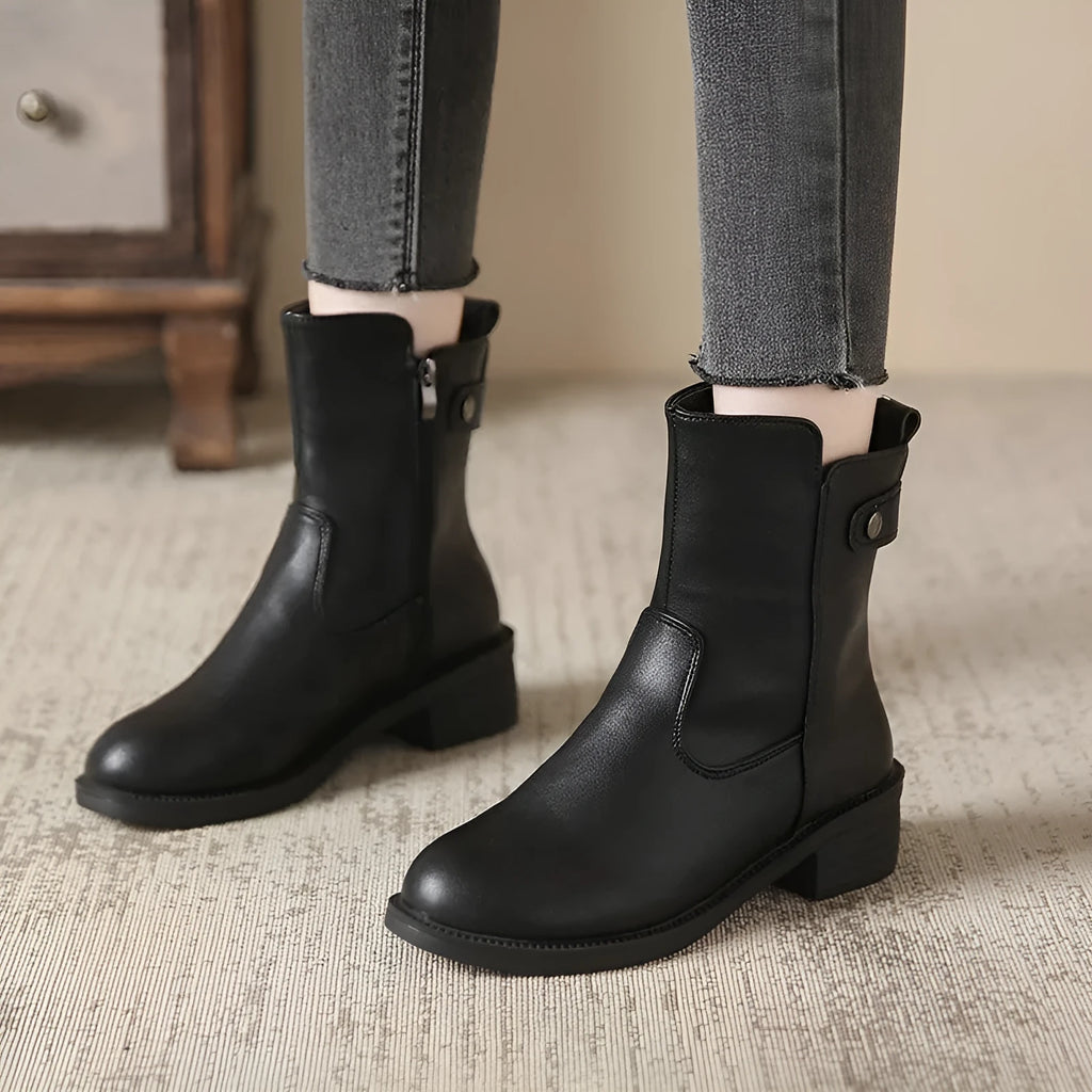 Black women's side zip boots with round toe and low rubber heel