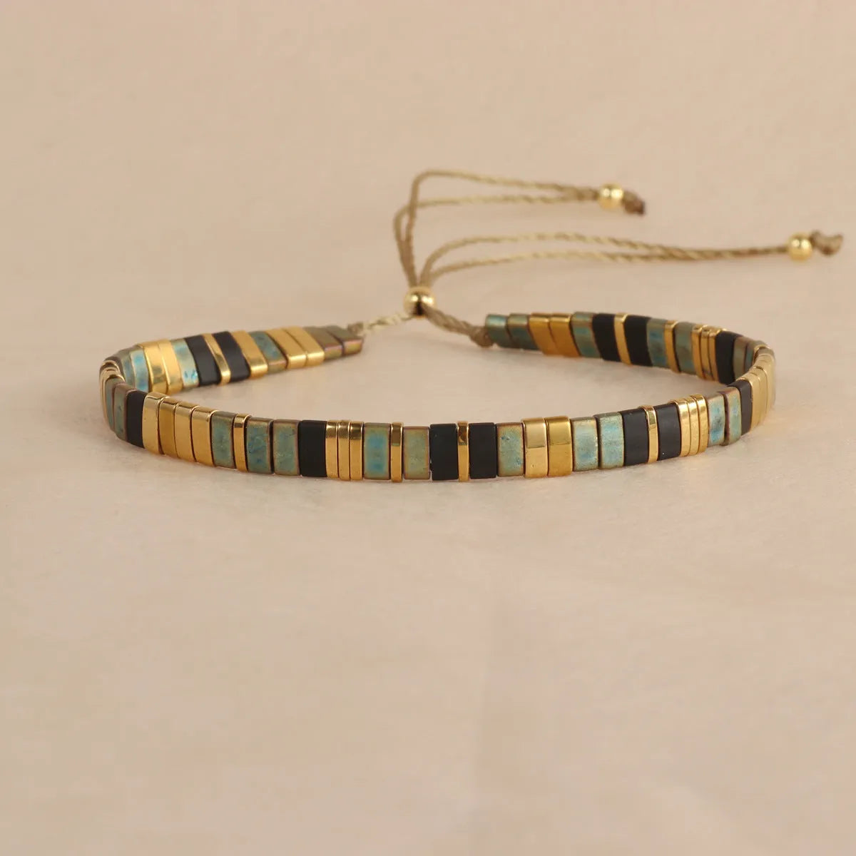 Geometric glass bead bracelet with pull bead closure in five colour options
