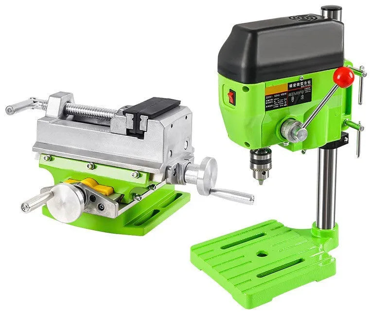 Mini bench drill and milling machine with heavy-duty bench pliers on a workbench.