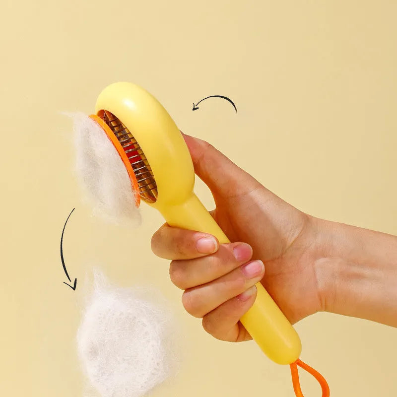 Small yellow duck-shaped pet comb with open and needle teeth for grooming cats and dogs.