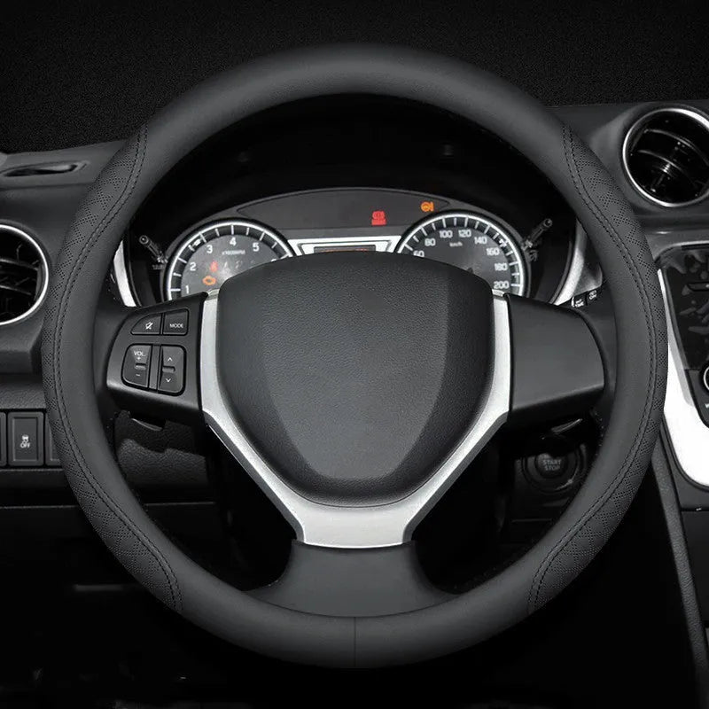 Black leather steering wheel cover with two-colour line detailing showing Napa leather texture and rubber inner ring