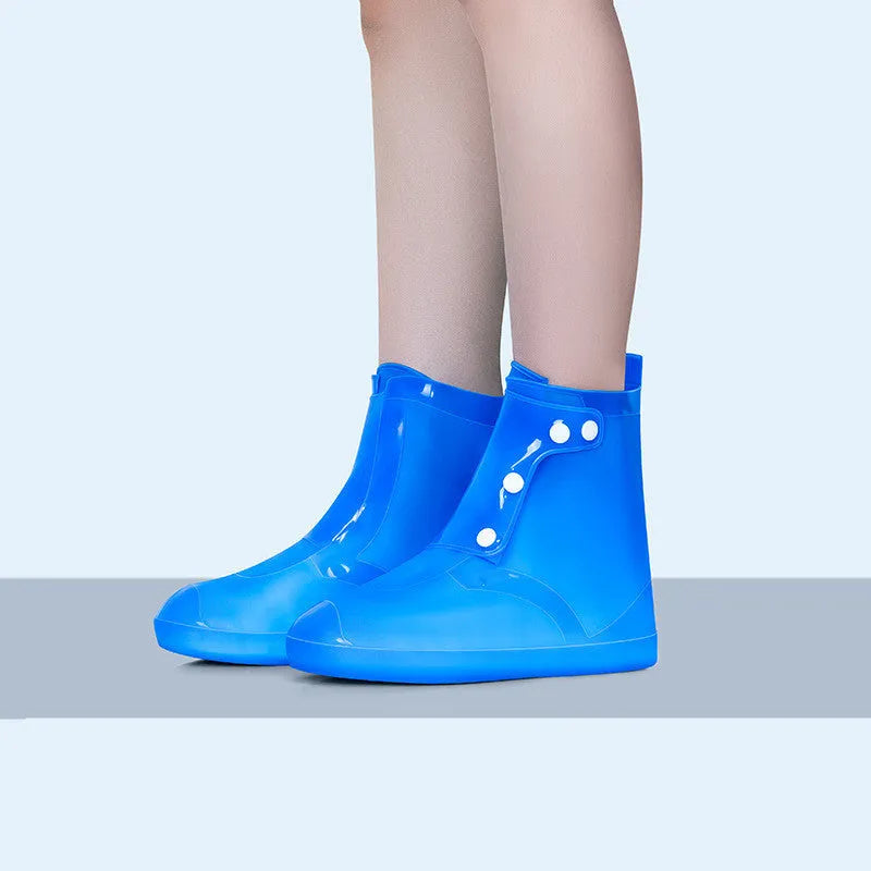 White high-top PVC waterproof reusable shoe covers for women, shown alongside size chart