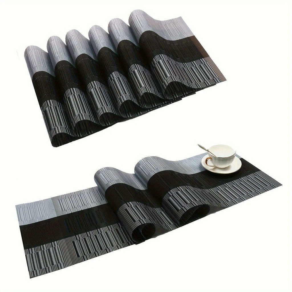 Modern non-slip PVC dish mat with gradient bamboo pattern in black, placed on a wooden dining table.