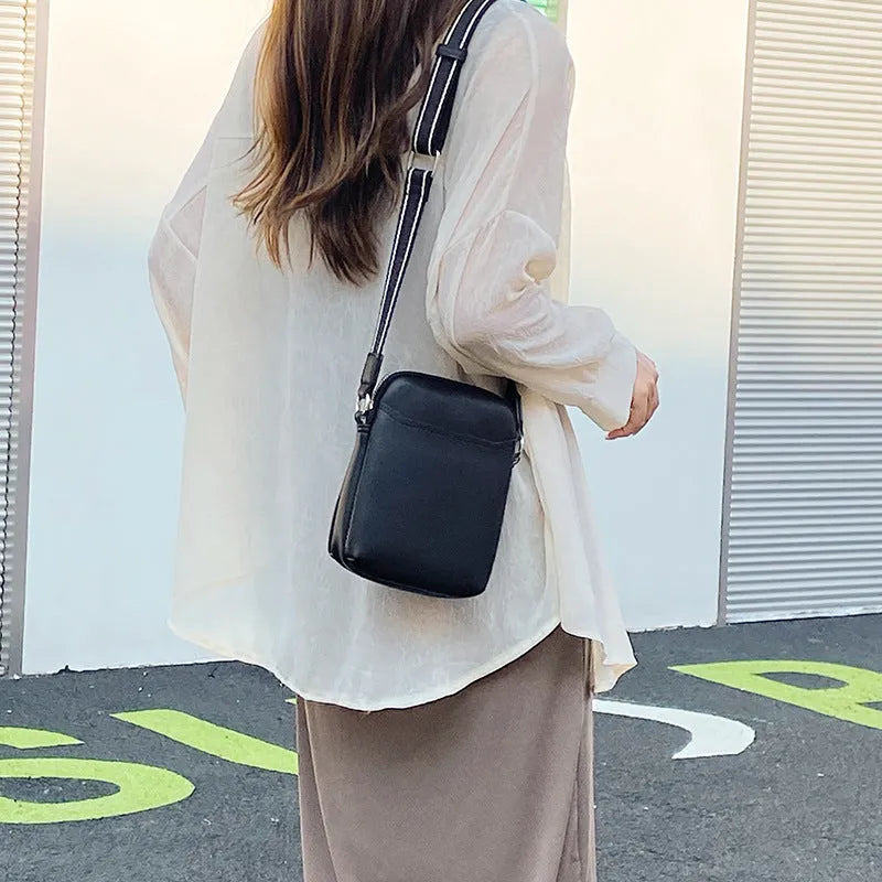Small solid colour crossbody phone bag for women in beige.