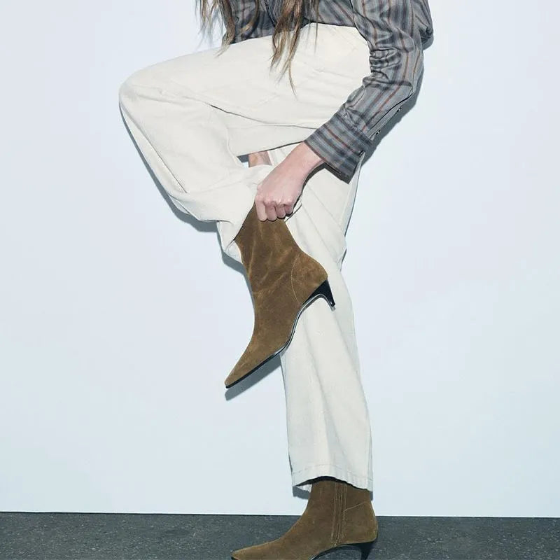 Brown women's square toe ankle boots with a side zipper and stiletto heel on a waterproof platform sole.
