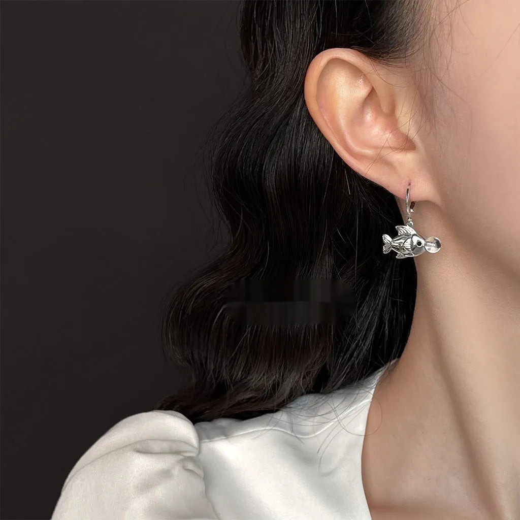 A pair of copper bubble fish earrings with goldfish design and electroplated finish.