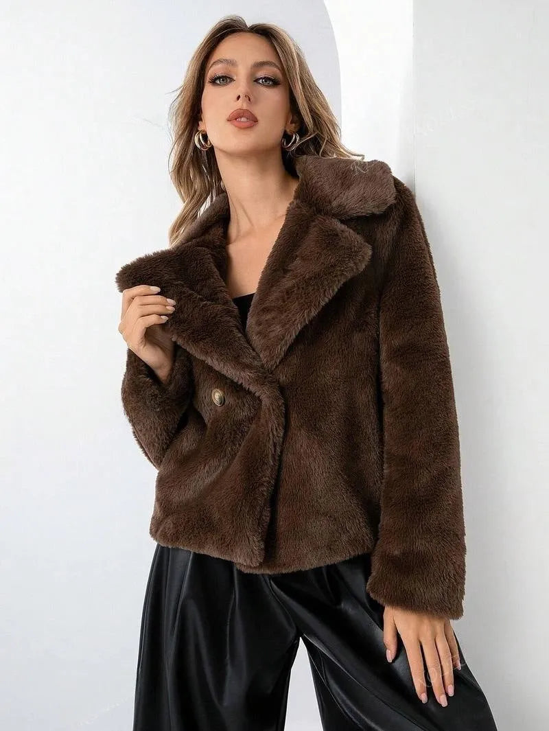 Rose red women's short faux fur coat with a loose fit and regular sleeves on a hanger.