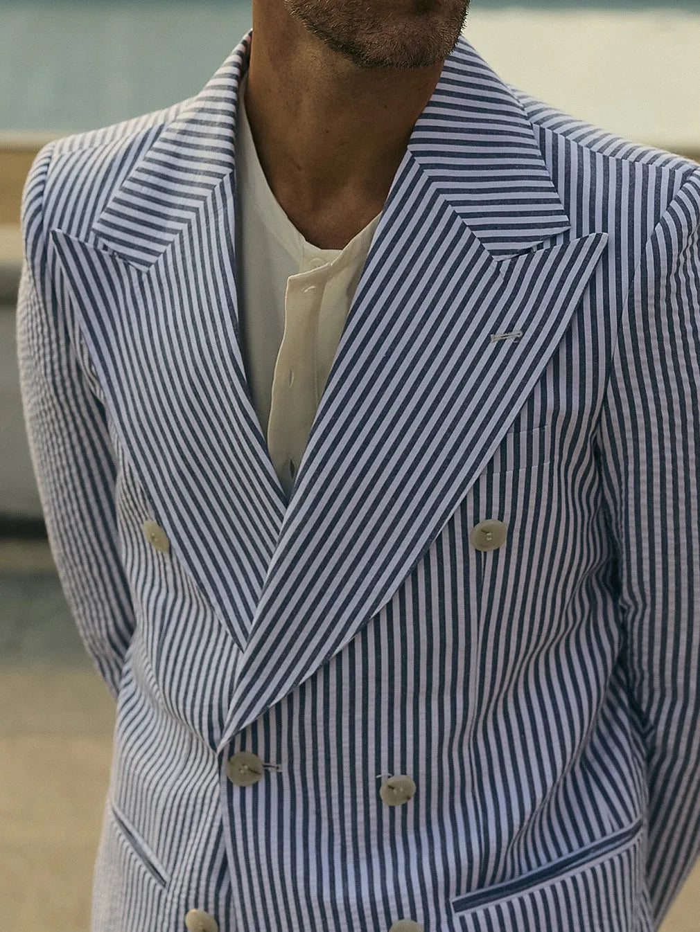 Blue and white striped polyester suit set with blazer and matching trousers