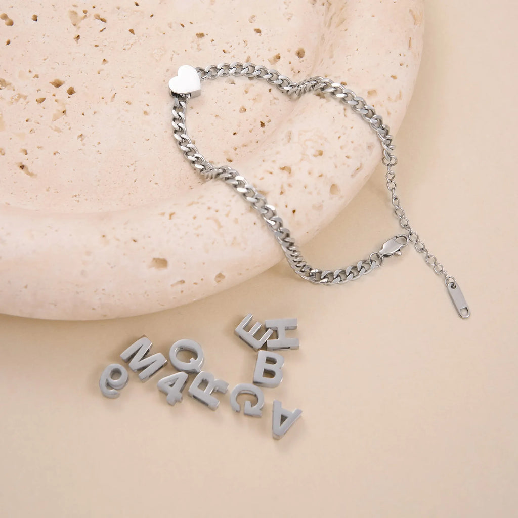Gold electroplated titanium steel necklace with letter pendant on matching chain