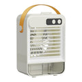 Dark green and ivory white compact USB desktop air humidifier on a wooden desk.