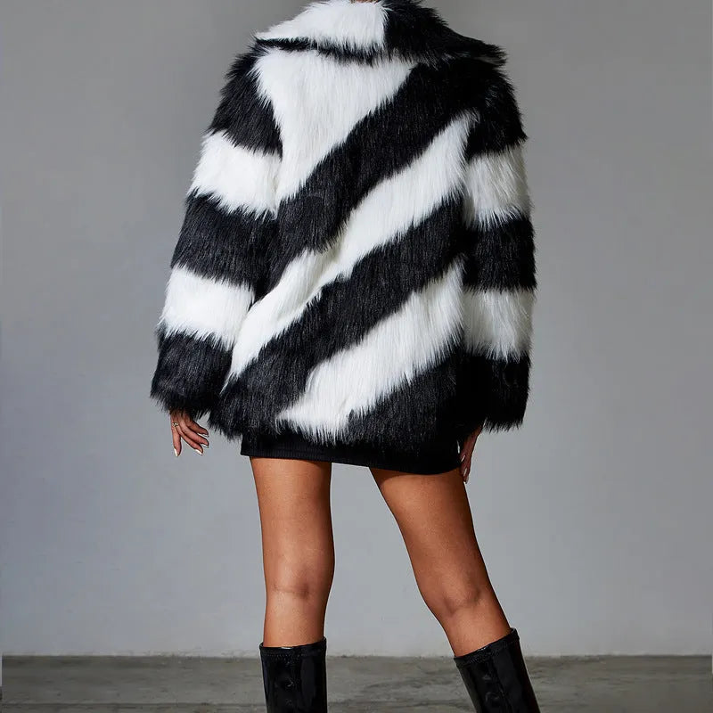 Women's lapel contrast colour faux fur coat with a detachable fur collar on a hanger