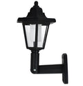 Black hexagonal solar-powered wall light with automatic sensor for outdoor garden or patio lighting