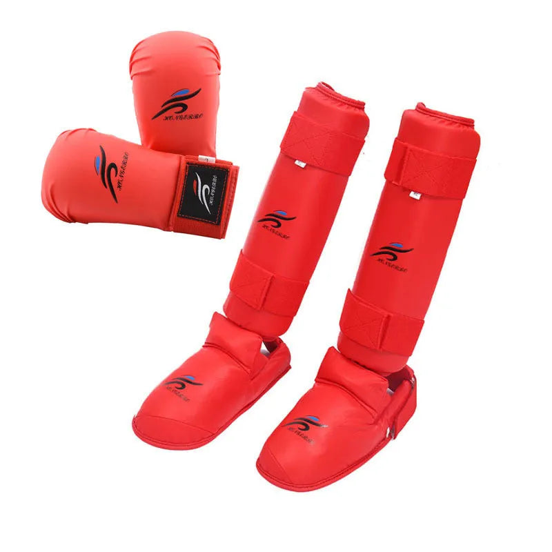 Red and blue karate taekwondo protective gear set showing leg guards, helmet, and boxing gloves