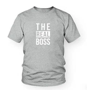 A plain, light grey men's loose-fit T-shirt with a round neck and short sleeves on a hanger.