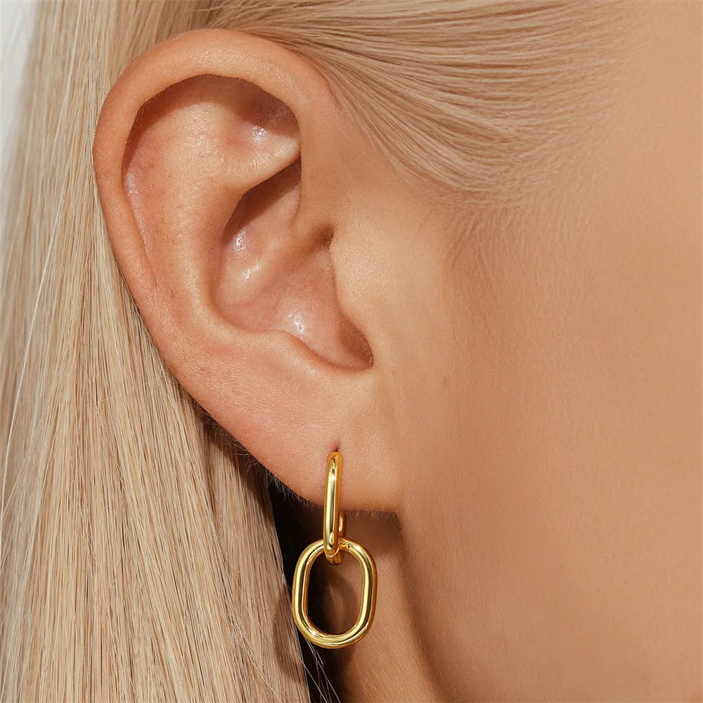 Brass diamond earclip earrings with geometric shape and gold electroplated finish