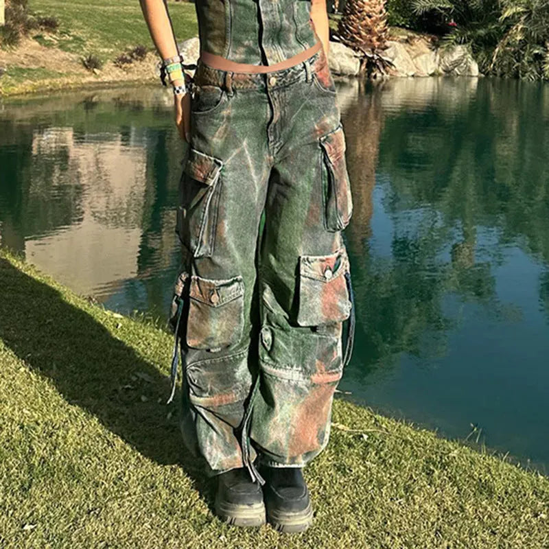 Loose fit multi-pocket cargo denim trousers with gradient colour pocket detail and collage stitching.