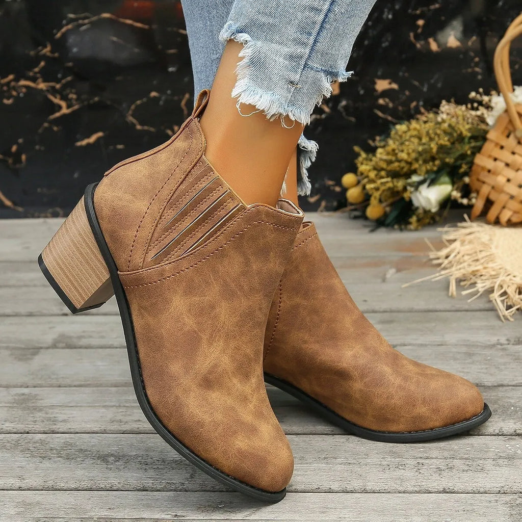 Women's black ankle boots with pointed toe and thick square heel design for autumn winter wear