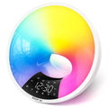 White WiFi smart sunrise alarm clock with dual alarm, FM radio, Bluetooth, and adjustable light on a bedside table