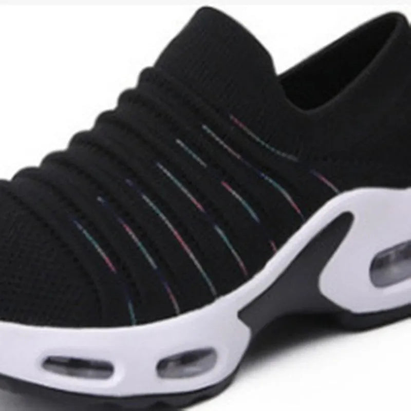 Plus size fly-knit socks shoes with mesh upper in multiple colour options showing round toe design