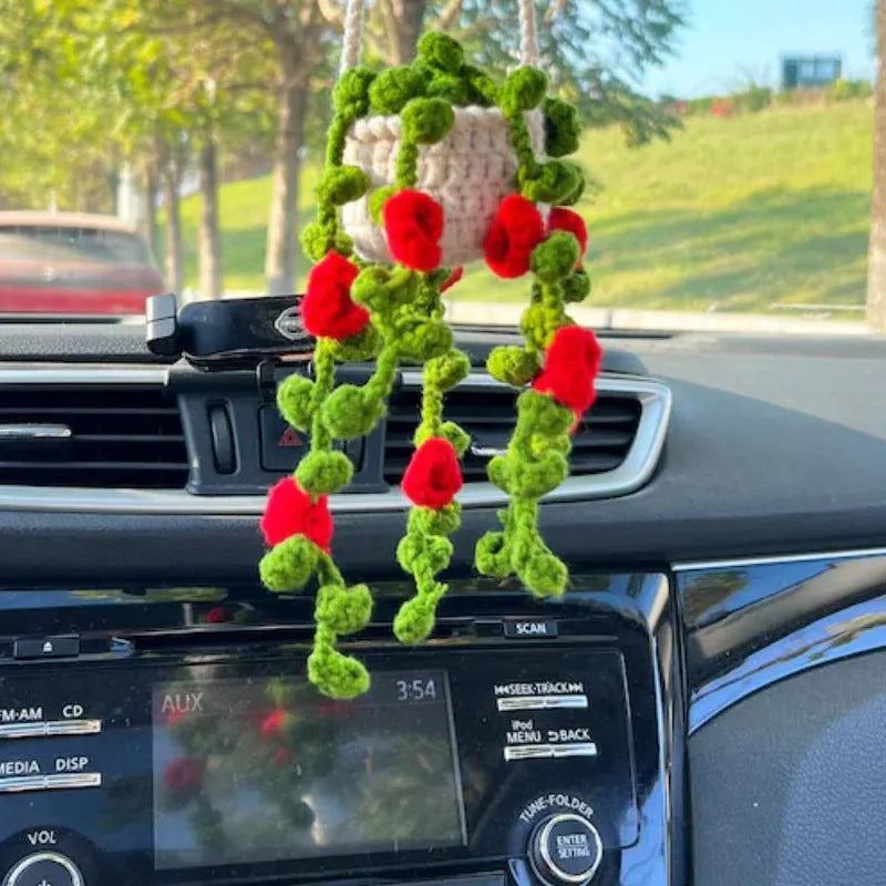 Green and white fish-scale style knitted wool car hanging planter with 8cm base and long white cord.