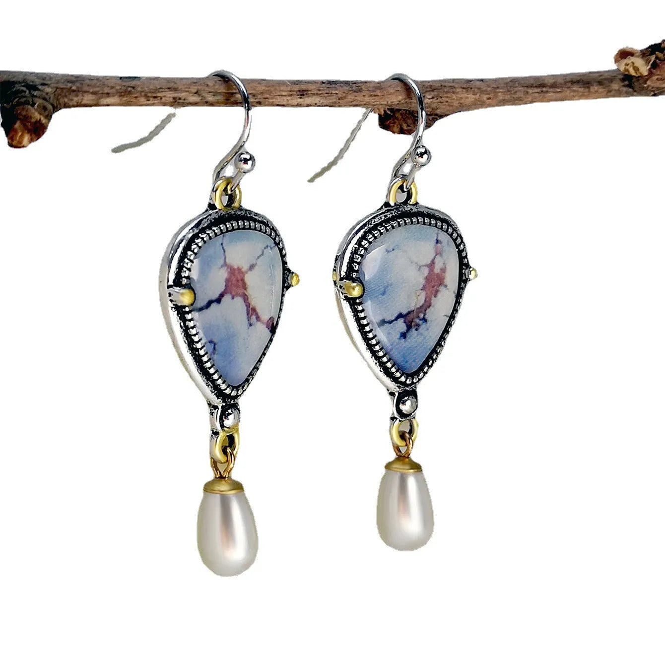 Retro blue geometric drop earrings with synthetic opal and white pearl details on electroplated metal.