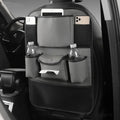 Leather car seat back storage bag in black, hanging behind a car headrest.