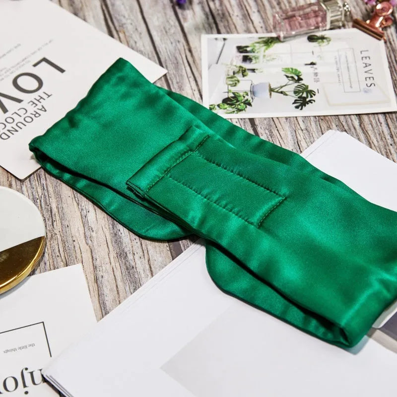 Mulberry silk sleep mask shown in one of seven colours: black, champagne gold, navy blue, silver grey, white, pink, or green.