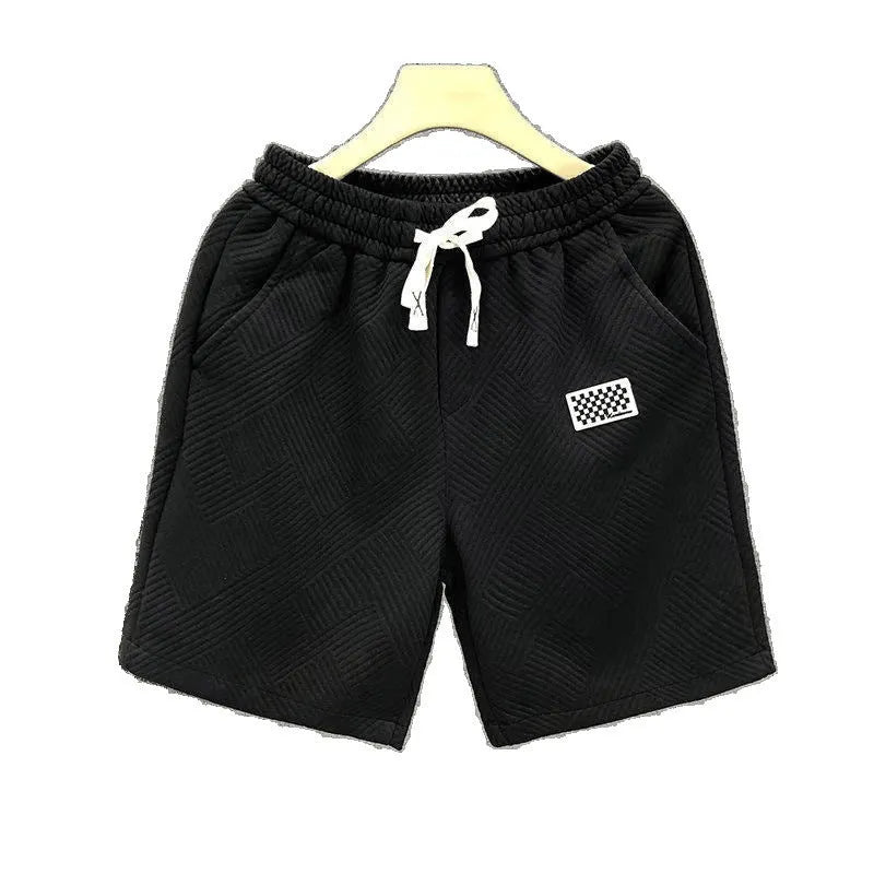 Polyester sports shorts in solid colours with micro elasticity for casual wear and beach activities