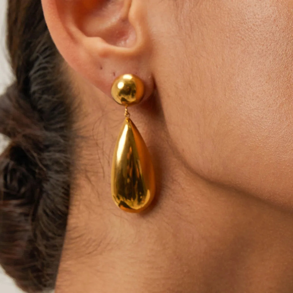 Gold electroplated stainless steel water drop pendant earrings with geometric hemisphere shapes