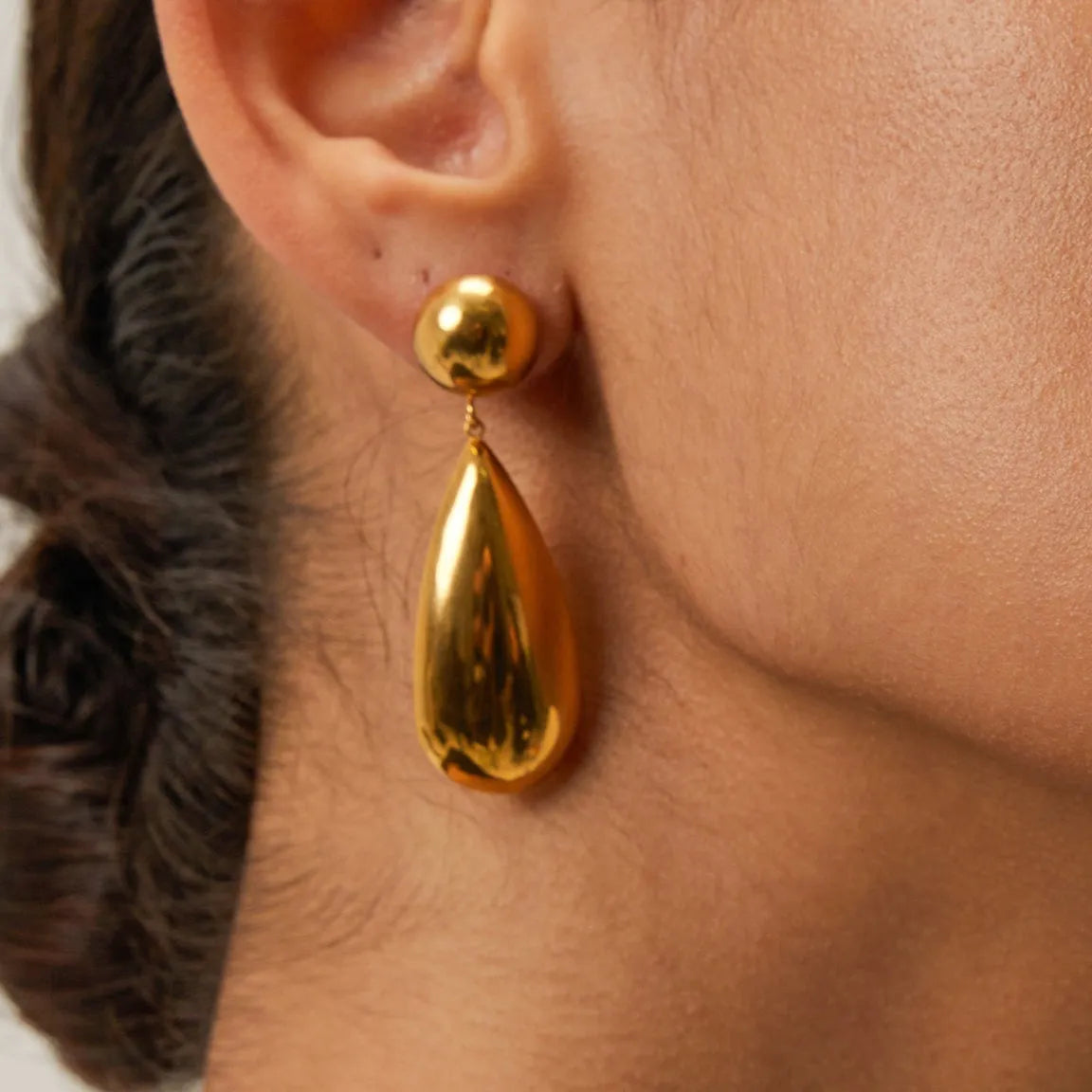 Gold electroplated stainless steel water drop pendant earrings with geometric hemisphere shapes