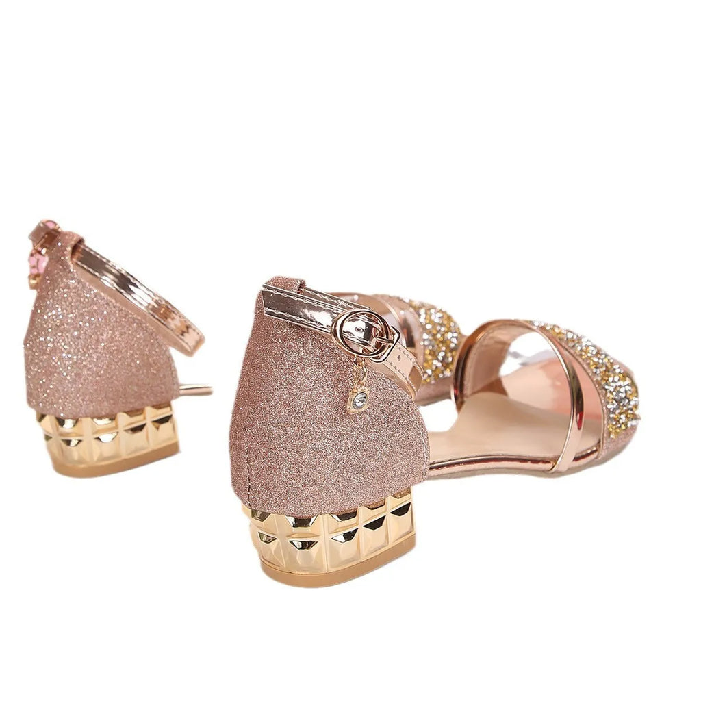 Women's plus size Roman-style sandal with rhinestone detail, buckle strap, and fish mouth toe opening.