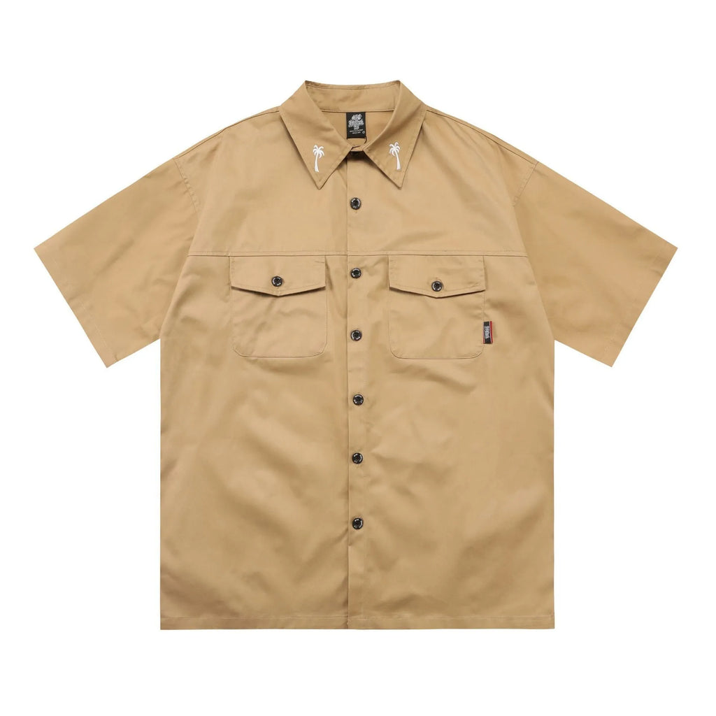 Men's loose fit black embroidered half-sleeve work shirt on a hanger.