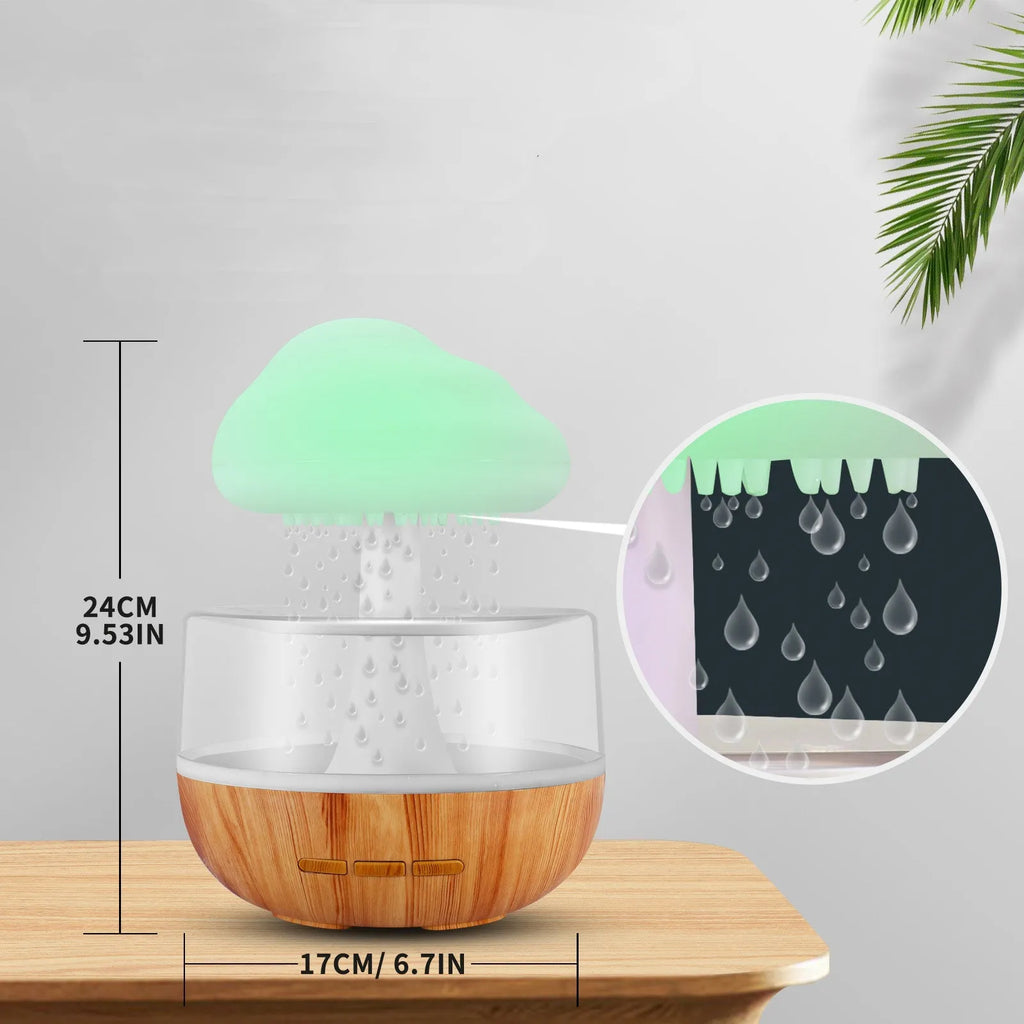White cloud-shaped humidifier with night light and water flow display on wooden surface