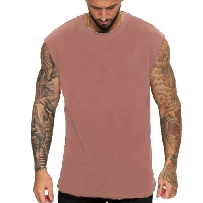 Men's loose fit solid colour cotton tank top shown in a selection of available colours and sizes.