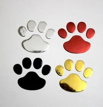 PVC car sticker with hand-shaped brush dog footprints design on a car bumper.
