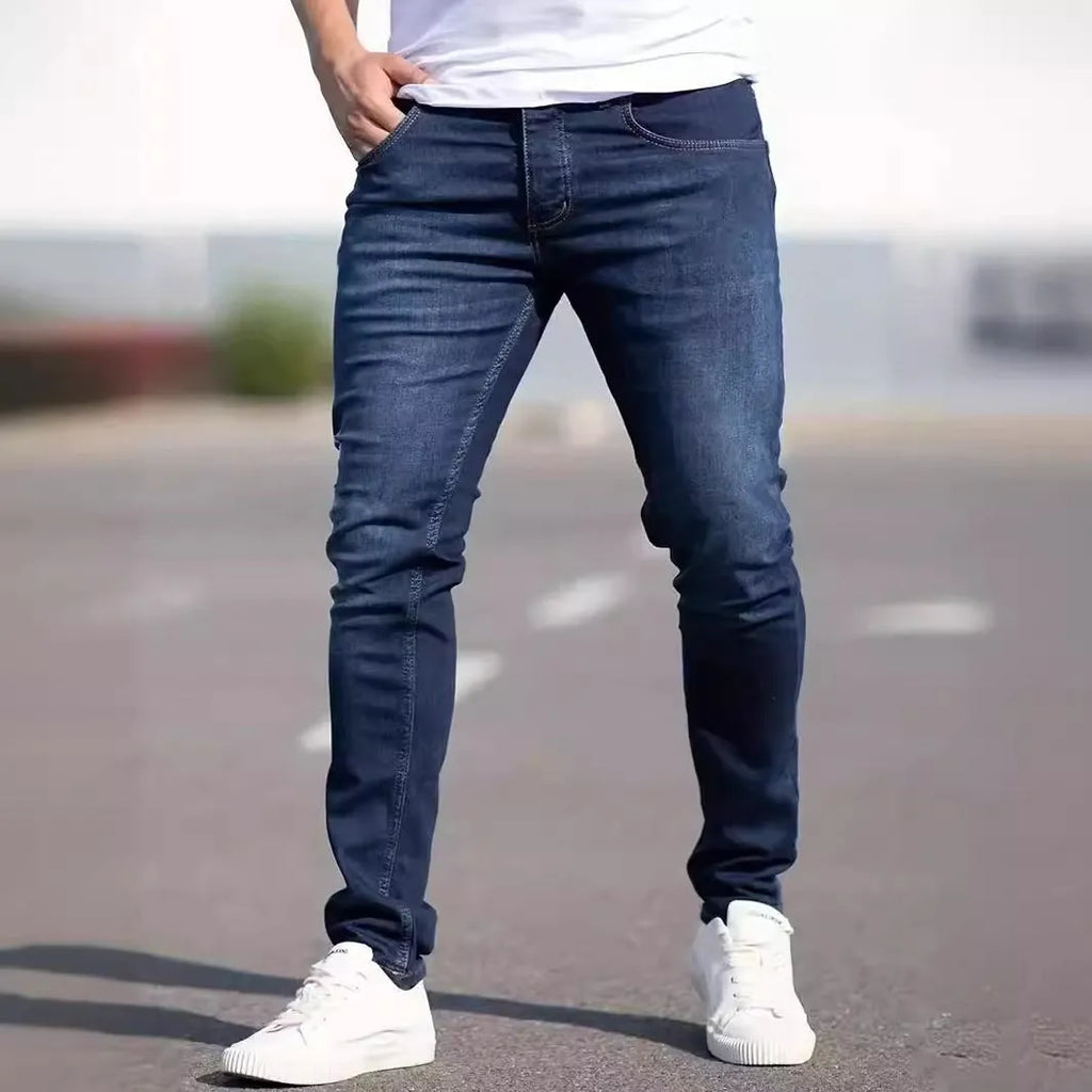Dark blue men's slim fit casual jeans with medium elastic cotton construction