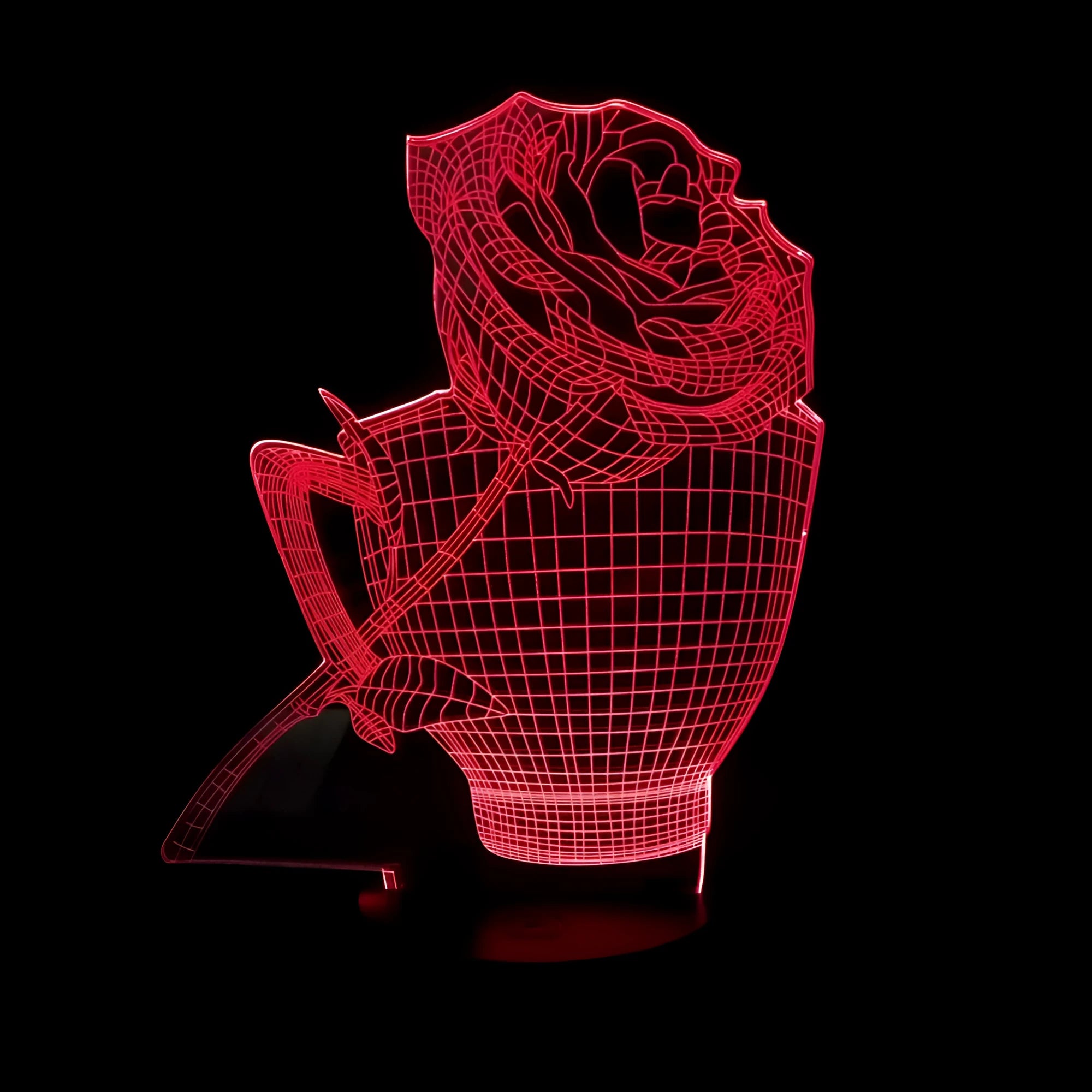 A 3D acrylic rose LED night light with a black base, displaying a purple glow, sitting on a wooden surface.