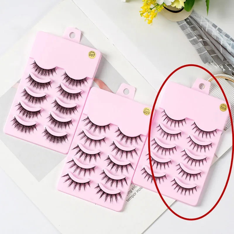 Pack of 5 pairs of black manga-style false eyelashes with natural wispy length on a white background.
