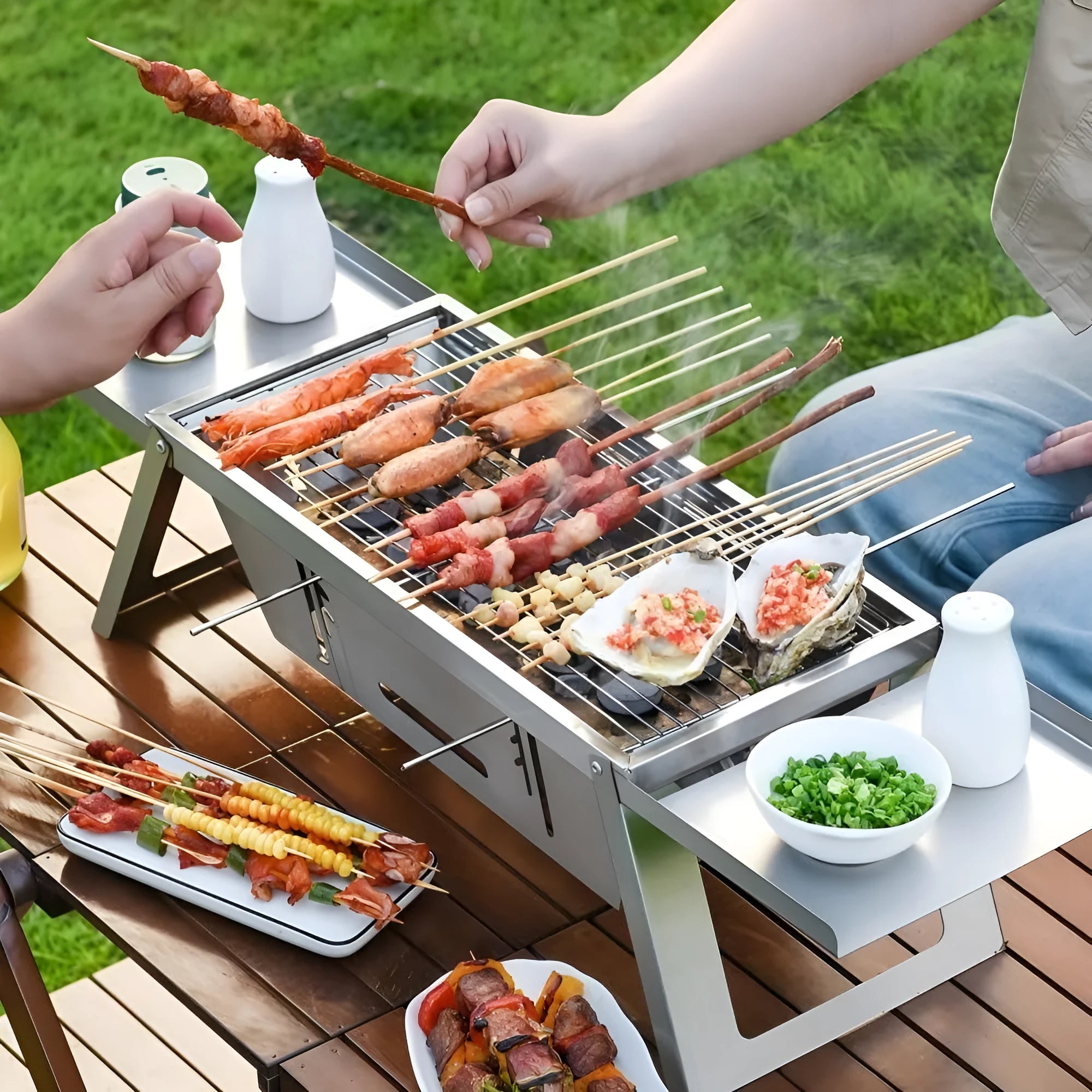 Small foldable portable charcoal barbecue grill for outdoor cooking