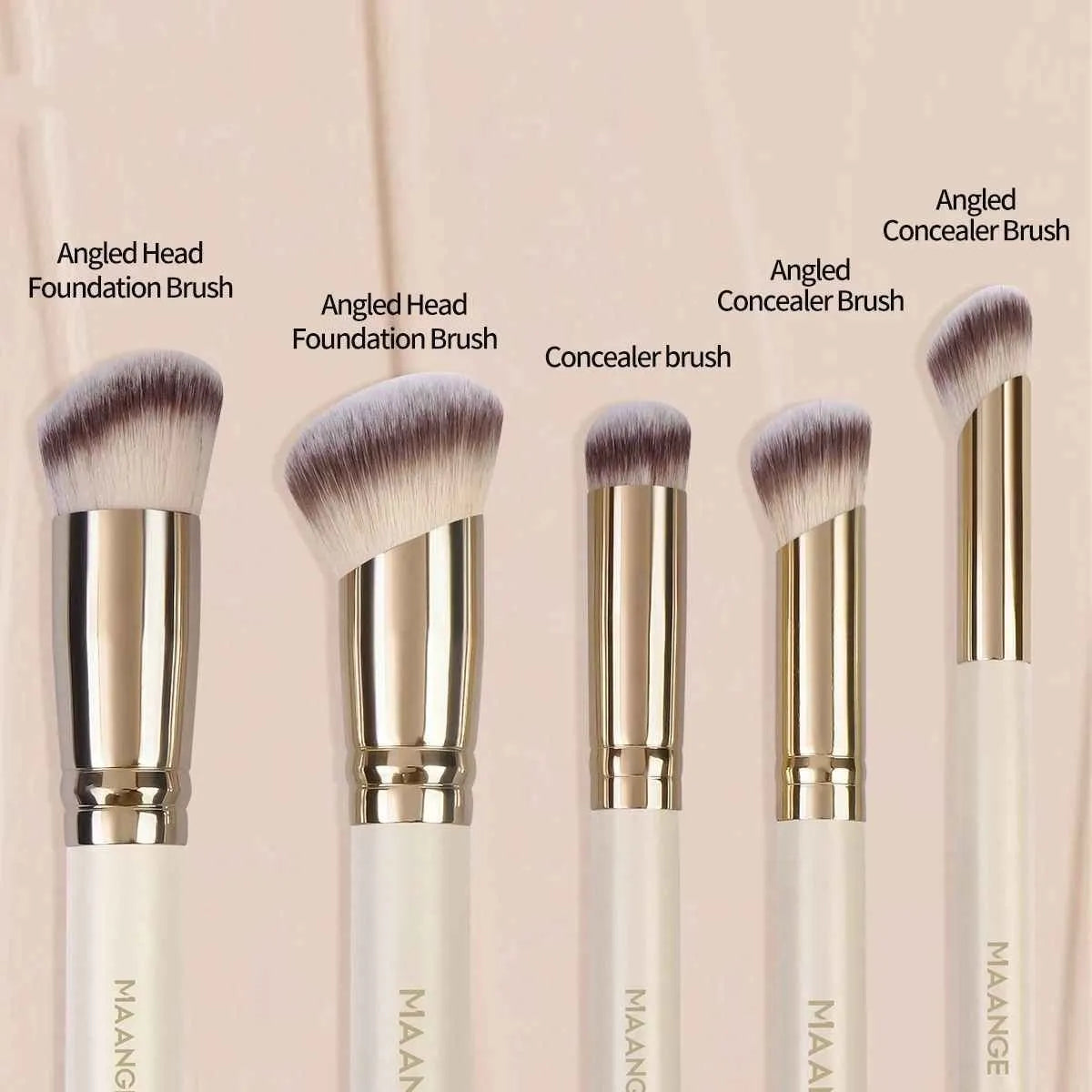 Five apricot coloured makeup brushes with angled blush brush design on white background