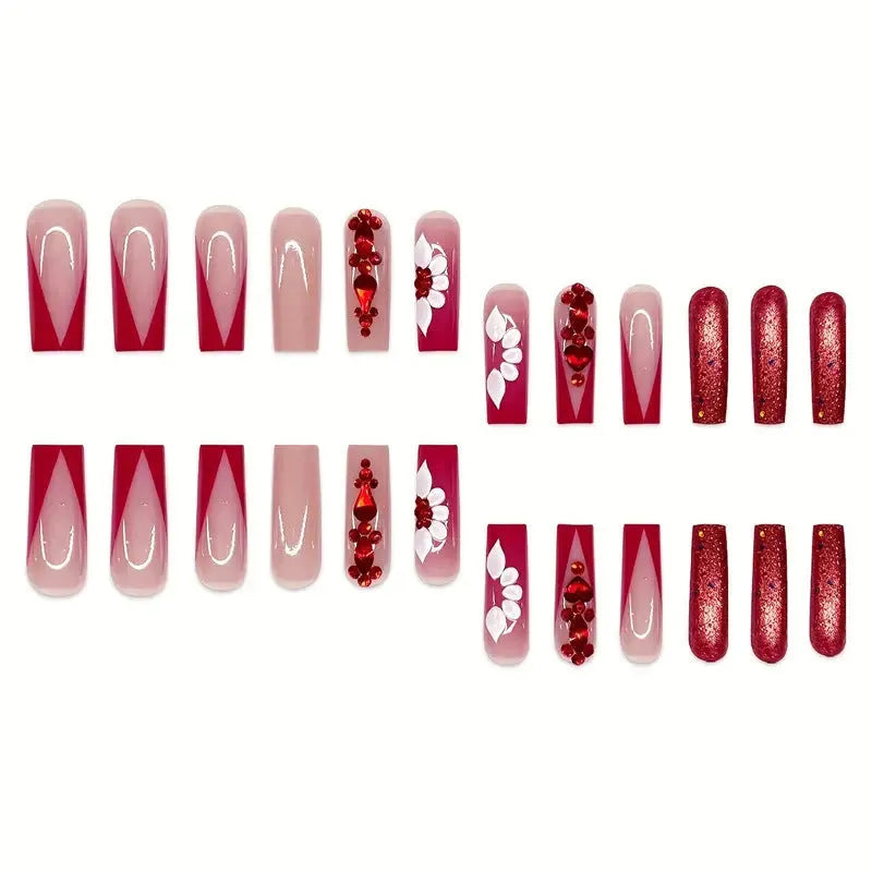 Artificial nails with red floral pattern and prismatic diamond decorations in long square shape