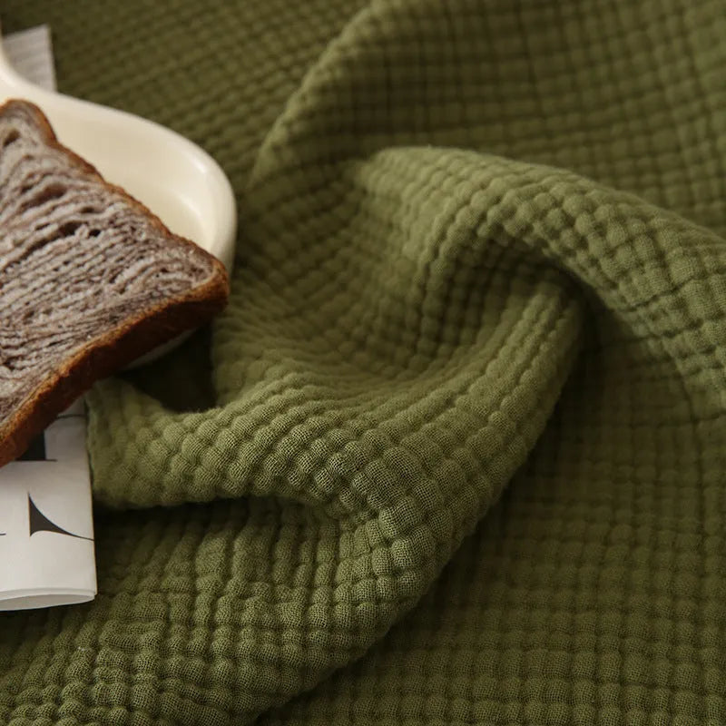 Four-layer gauze cotton blanket with tassel trim in a choice of ten colours and two sizes.