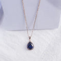 Pink rose gold drop shape rhinestone necklace with geometric design on alloy chain