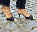 Women's apricot and black colour block stiletto sandals with pointed toe and buckle.