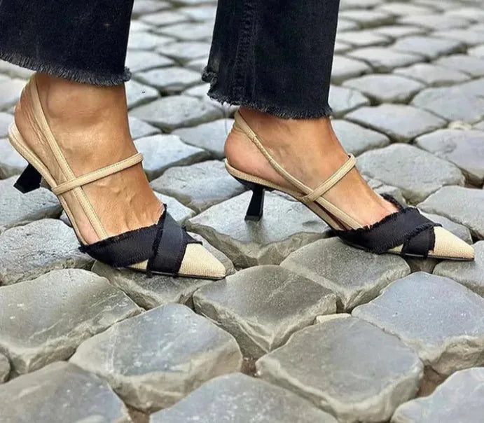 Women's apricot and black colour block stiletto sandals with pointed toe and buckle.