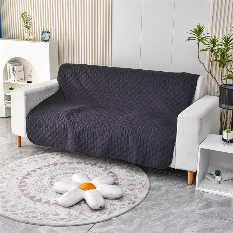Reversible waterproof dog blanket couch cover in burgundy and grey, laid flat on a sofa.