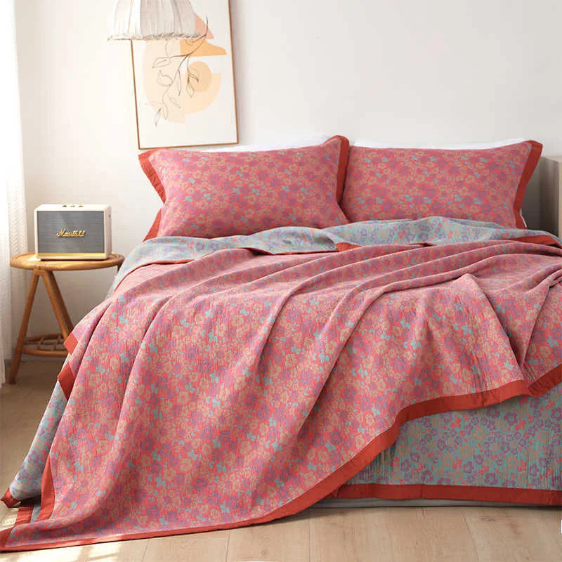 Cotton gauze bed blanket three-piece set with floral plant pattern showing blanket and two pillowcases