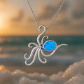 Silver opal octopus pendant necklace on a stainless steel box chain.