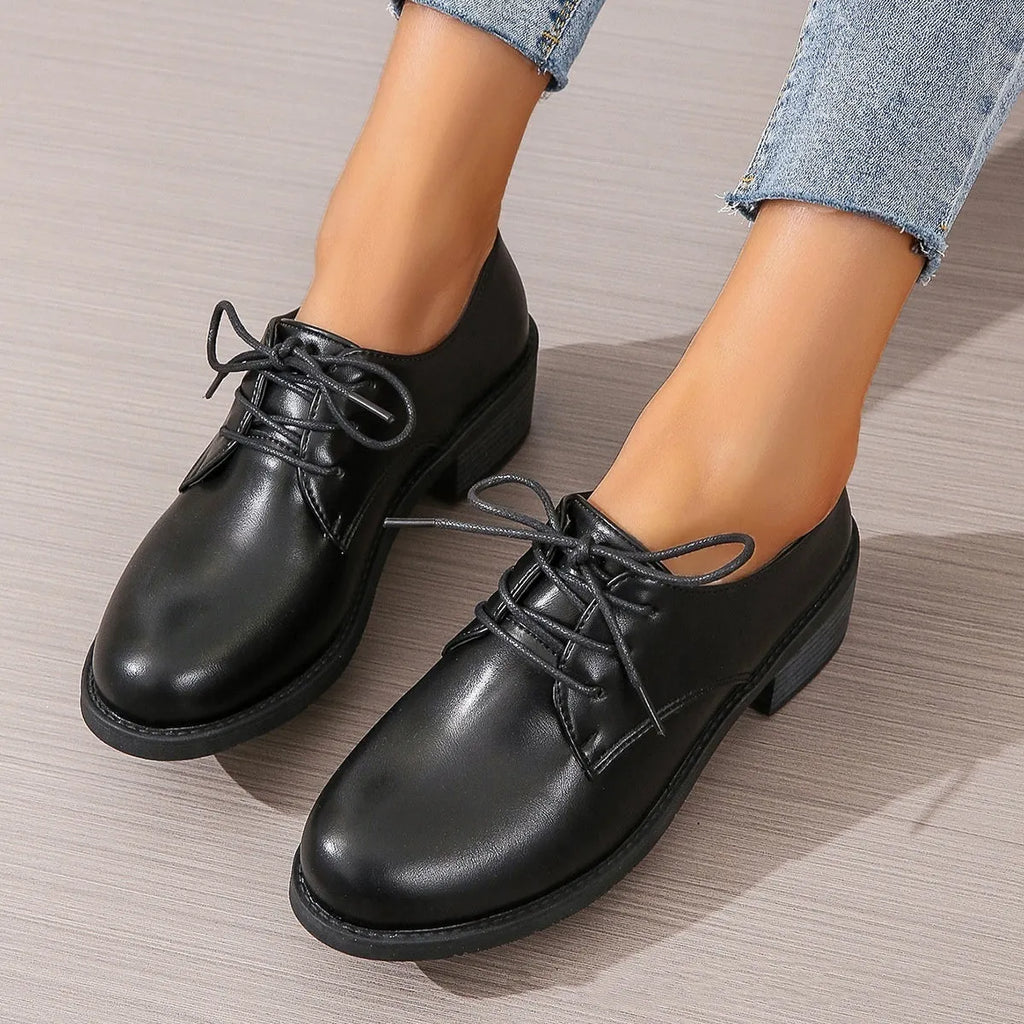 Black women's leather work shoes with thick chunky heel and pointed toe
